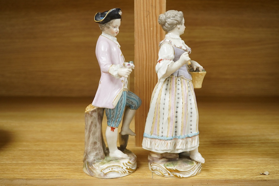 A pair of Meissen style porcelain figures of flower sellers, largest 20.5cm high. Condition - fair, some chipping and losses